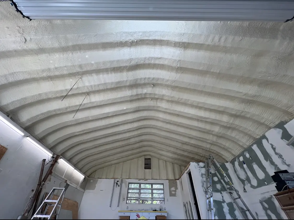 Spray polyurethane foam applied to the underside of a metal roof deck in Pacific Grove